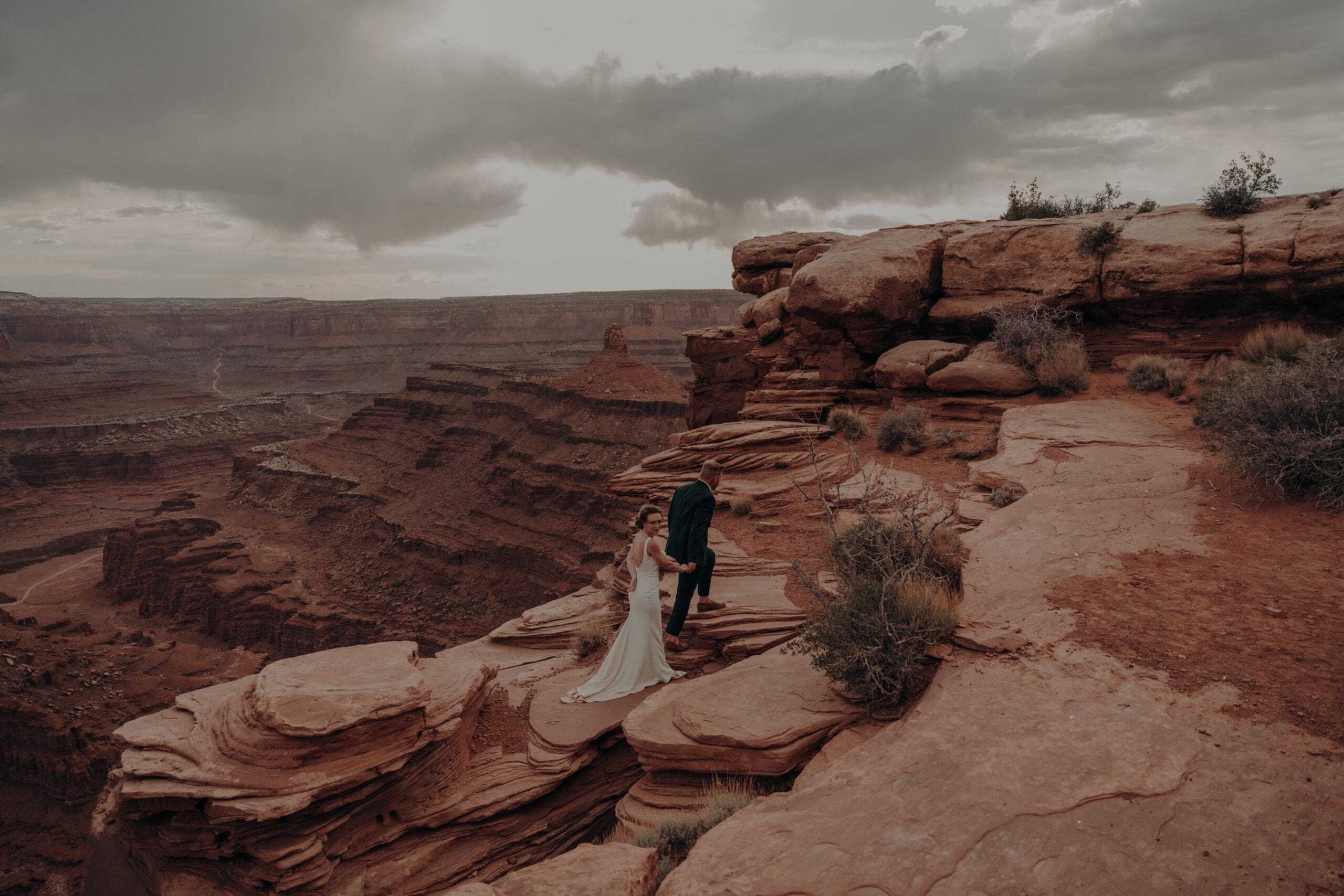 moody dead horse point elopement couple at sunset